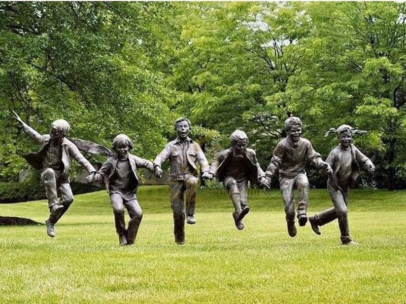 bronze children on the grass